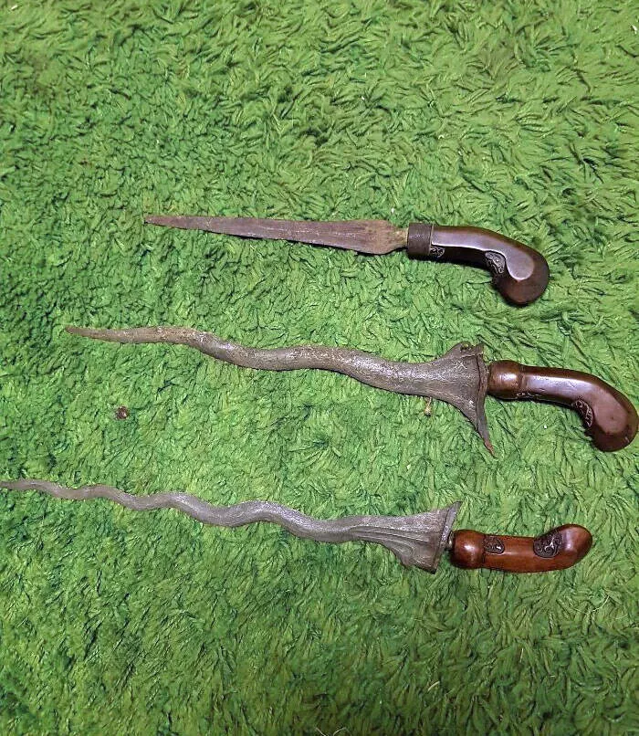 Surprising finds at home unintentional discoveries that stunned residents - #39 Found these in the basement of an old house. Apparently, the bottom two are Kris daggers from Indonesia. The top one may technically be as well