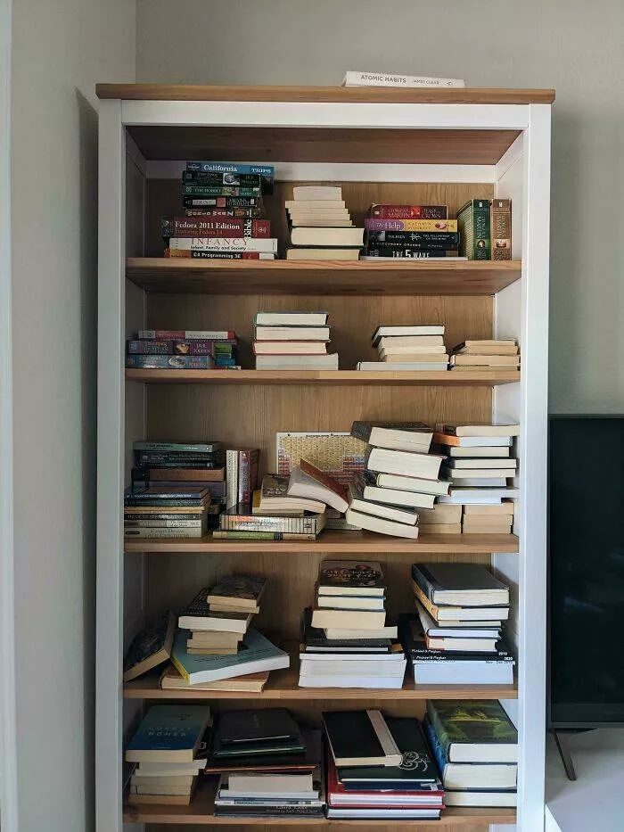 Frustration unleashed partners hilariously incompetent moments go viral - #13 The Way My Husband Unpacks the Book Boxes