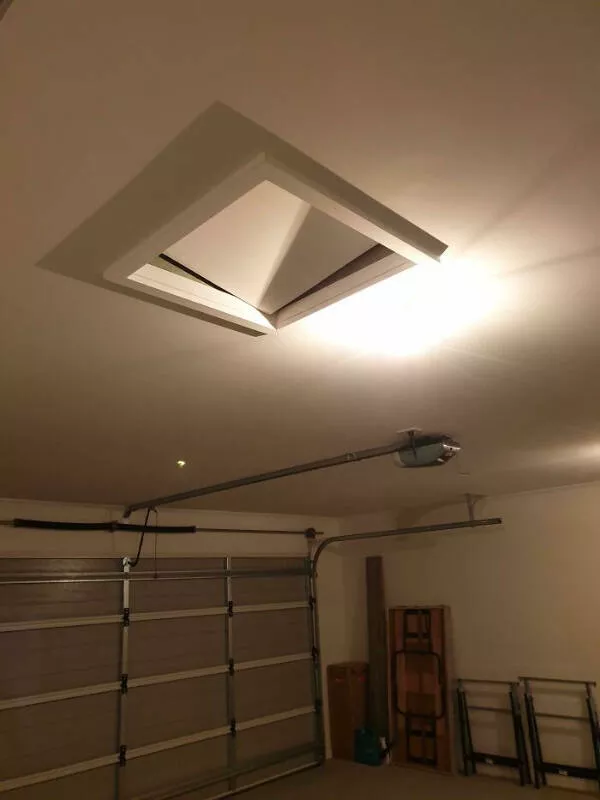 Enigmatic visuals unsettling images for a haunting experience - #4 Late at Night, I Hear a Loud Bang from My Garage. Upon Investigation, I Notice the (Previously Flush and Fairly Heavy) Crawl Space Cover is Ajar.
