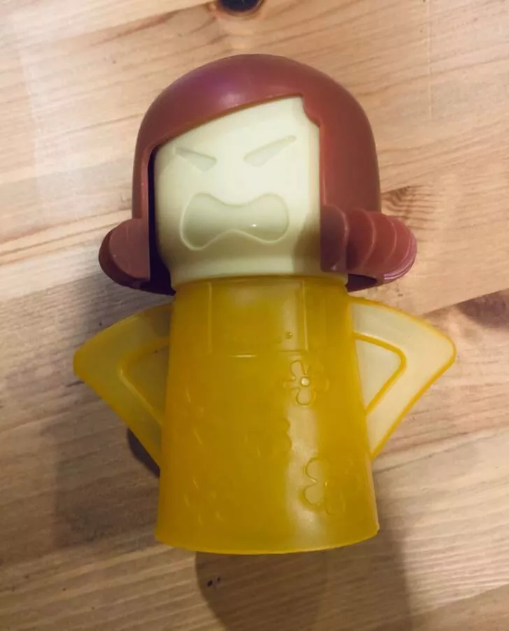 Revealing mysteries unveiling the secrets of enigmatic objects - #22 This angry-faced plastic lady I found is about the height and width of a pop can. It is able to come apart in three pieces. What is it?