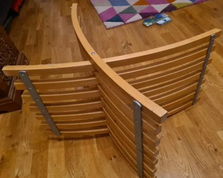 Revealing mysteries unveiling the secrets of enigmatic objects - #7 The previous owner of the house left it in the garage. It's a curved wooden slatted thing that pivots in the middle.