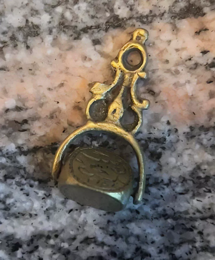 Puzzling enigmas unveiling the mystery objects that left everyone scratching their heads - #6 What is this gold rotating thing? It's about 5-7 cm in length and has what seems like drawings on each side?
