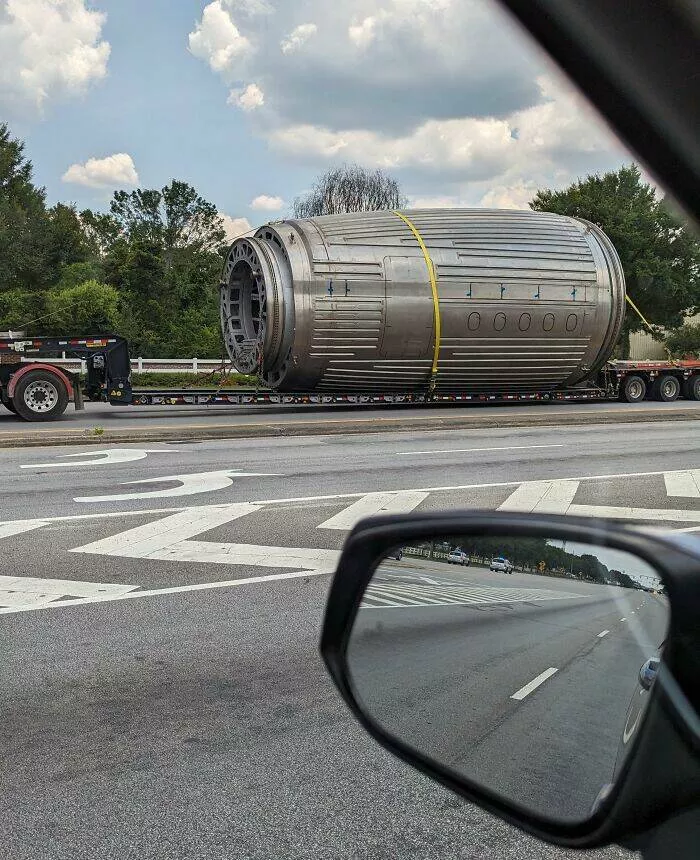 Puzzling enigmas unveiling the mystery objects that left everyone scratching their heads - #9 Large metal tube with narrowed front end, transported with police escort, on an extended flatbed trailer