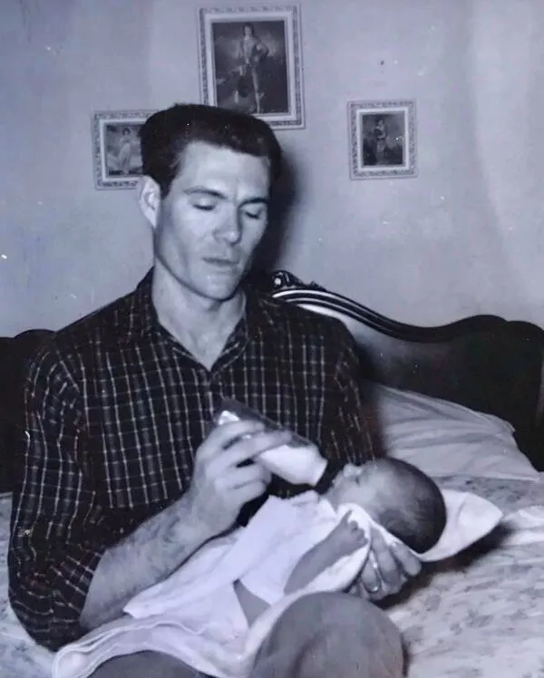 Nostalgic charm exploring the allure of vintage vibes - #12 A candid shot of my sleep-deprived grandfather feeding my mother, dating back to the 1960s Nostalgic charm exploring the allure of vintage vibes - #12 A candid shot of my sleep-deprived grandfather feeding my mother, dating back to the 1960s