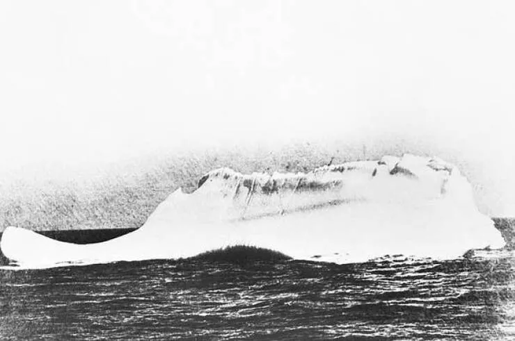 Rare historical photos that will alter your worldview - #35 This is what the iceberg that sank the Titanic looked like after being hit: