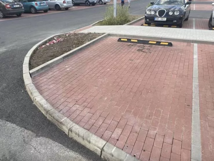 Design fails when creativity misses the mark - #14 A randomly elevated parking spot that you'd better navigate carefully