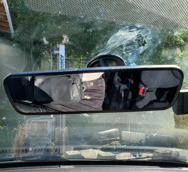 Capturing this summers extreme temperatures - #6 It's so hot that my rear-view mirror is sliding down the windshield.