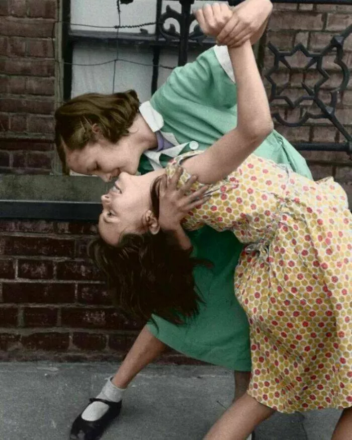 Unveiling hidden histories rare photos that tell untold stories - #19 Two girls dancing in the streets of London, 1954