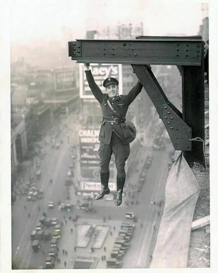 Unveiling hidden histories rare photos that tell untold stories - #33 A Member Of The New York Police Force Hangs From A Girder, 1920