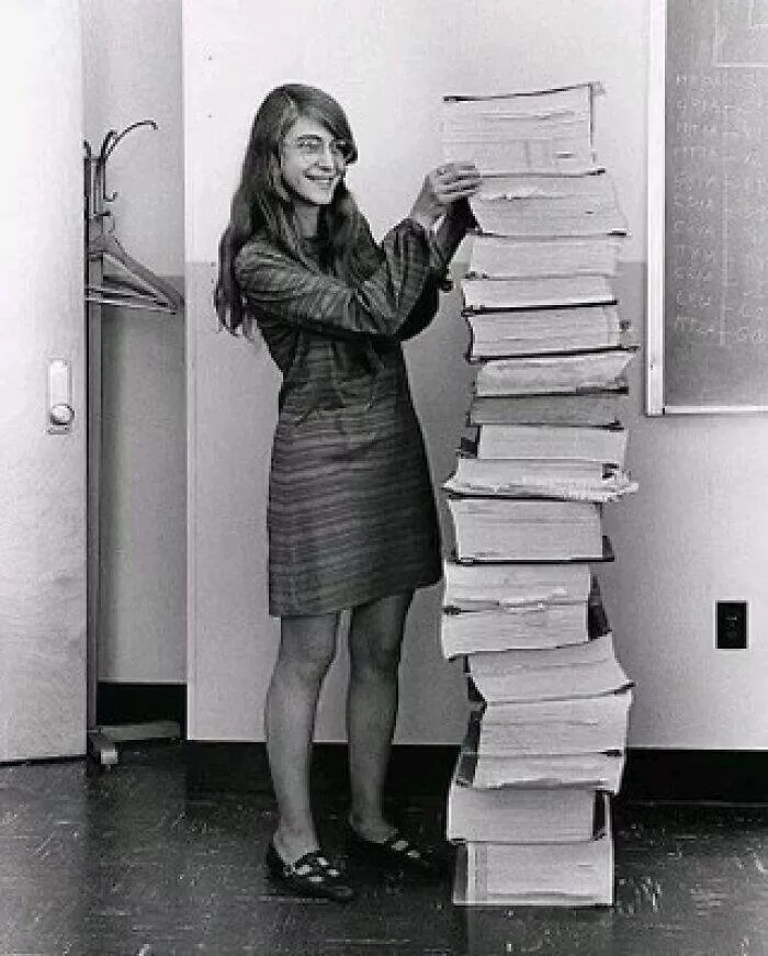 Unveiling hidden histories rare photos that tell untold stories - #4 Margaret Hamilton standing next to the navigation software she and her team at MIT wrote for the Apollo program, 1969