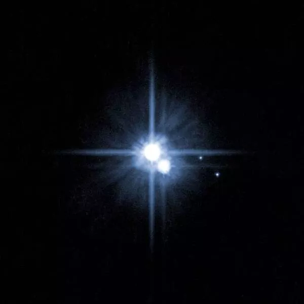 Awe inspiring space images that will leave you speechless - #5 Here's a picture of Pluto and its moons captured in 2006: