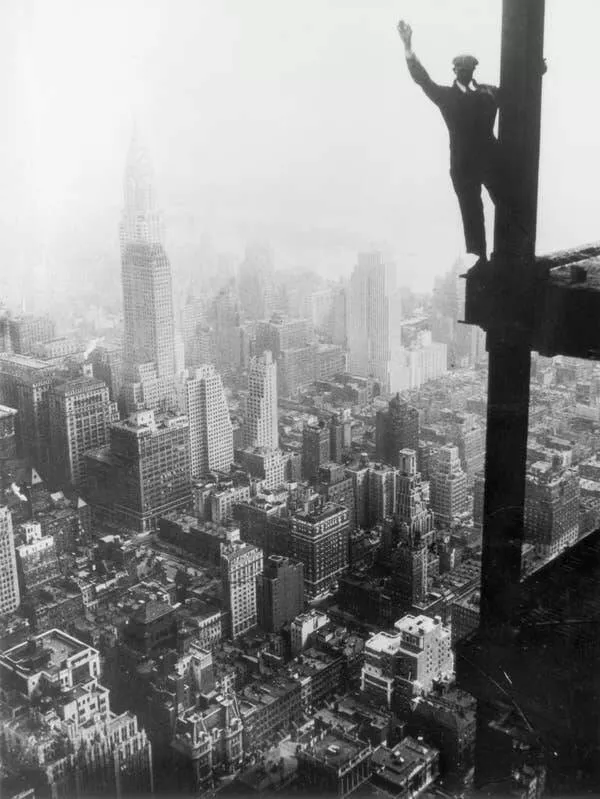 Intriguing images of historical construction projects - #21 A steelworker balances carefully on a girder during the Empire State Building construction in New York City.
