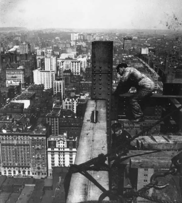 Intriguing images of historical construction projects - #29 A workman is painting the Eiffel Tower in Paris, October 1969.