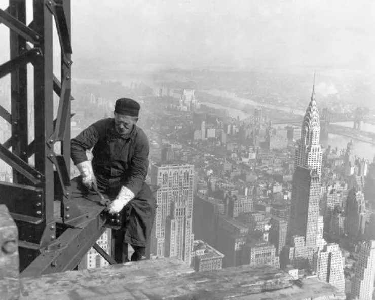 Intriguing images of historical construction projects - #6 A construction worker on the Empire State Building in New York City.