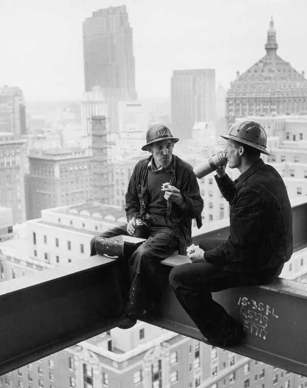 Intriguing images of historical construction projects - #9 Two New York construction workers enjoying lunch high above the cityscape.