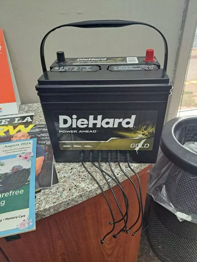 Intriguing photos that will instantly capture your attention - #37 This Phone Charger At The Repair Shop Looks Like A Car Battery