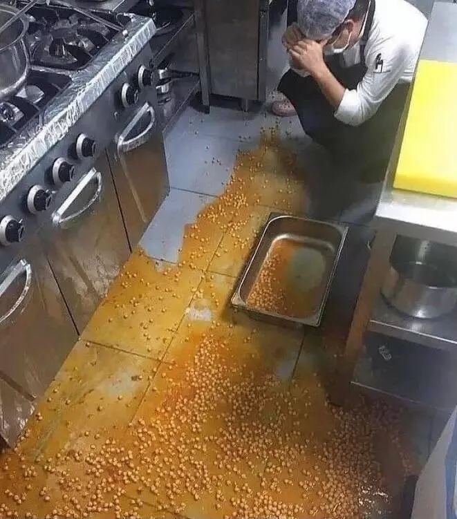 Epic pro kitchen disasters caught on camera - #23 The hands-over-face reaction really sums it up. Honestly, I’m more concerned about the cook’s poor feet in those hole-filled Crocs.