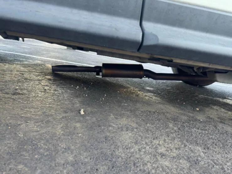 Moments that yell bad day - #13 Someone took a hack at one end of my catalytic converter—at least they didn’t manage to remove it completely.
