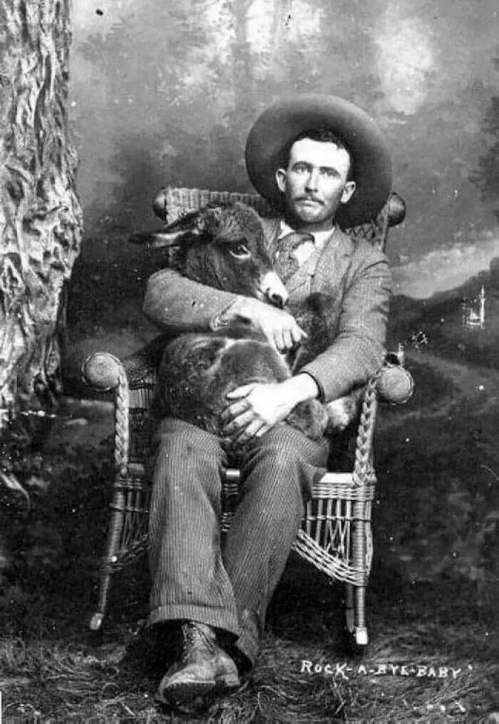 Rare historical photos that reveal fascinating stories - #3 A gentleman cradling a donkey, early 1910s