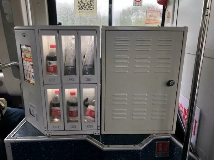 Photos that show how unique china really is - #22 Buses in Guangzhou are equipped with vending machines offering water, tissues, and umbrellas