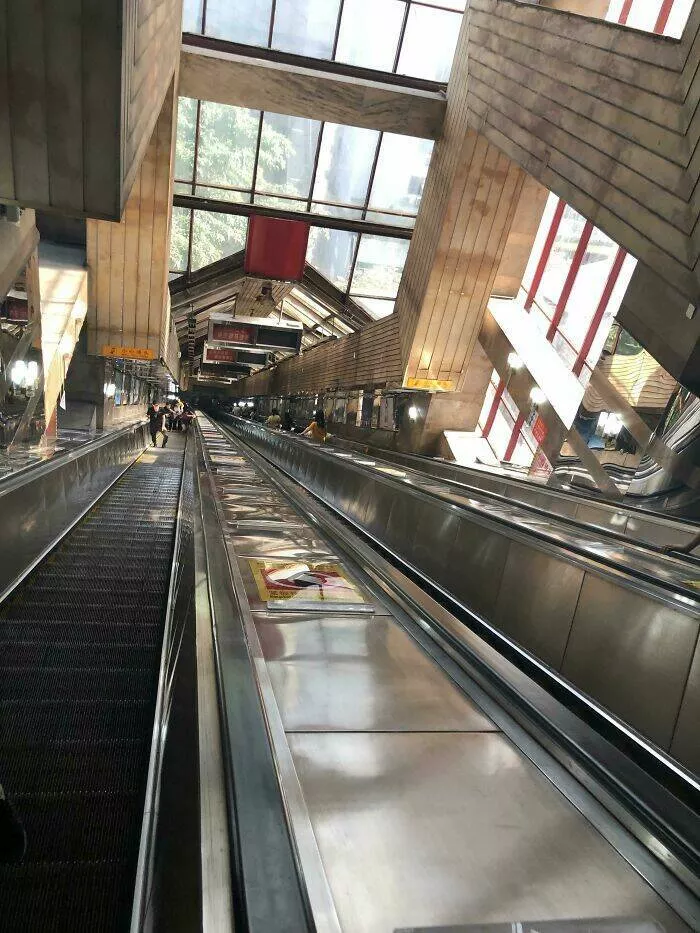 Photos that show how unique china really is - #41 An incredibly long escalator at Chongqing subway station in China