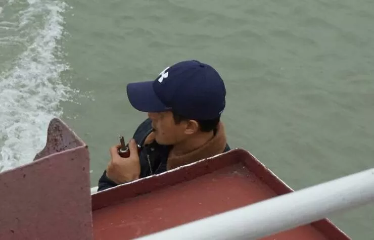 Photos that show how unique china really is - #42 A man smoking a cigar through a pipe in China