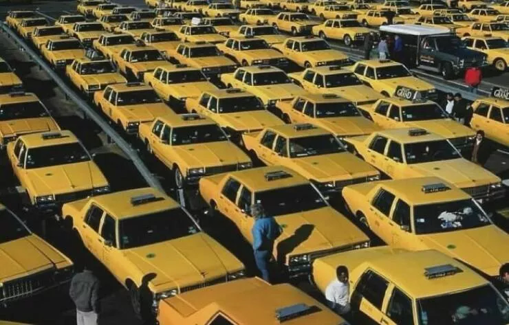 Nostalgic 90s photos that capture the decades unique vibes - #34 Nostalgic photo from JFK airport (NYC) featuring a sea of yellow taxis, 1991