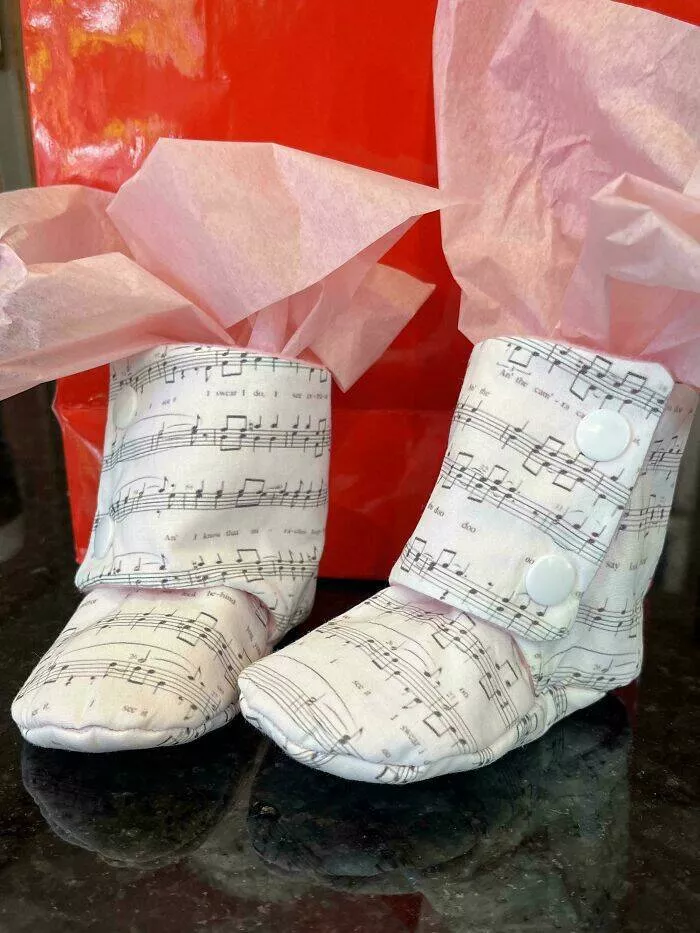 Creative diy projects that will inspire your inner maker - #17 Printed a couple’s wedding song sheet music onto fabric to make baby booties for their first child