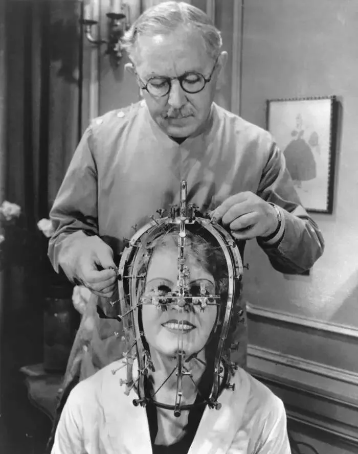 Fascinating images from around the world - #4 Makeup artist Max Factor with his invention, the beauty calibrator, designed to highlight which areas of the face needed more or less makeup: