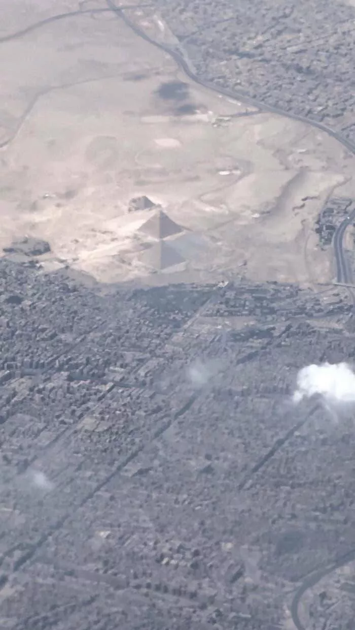 Rarely seen photos of iconic places that will change your perspective - #35 A stunning aerial view of the pyramids of Giza from a plane: