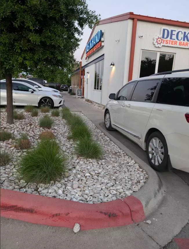 Visually pleasing moments you didnt expect - #14 This Seafood Spot Uses Oyster Shells Instead of Gravel in the Parking Lot