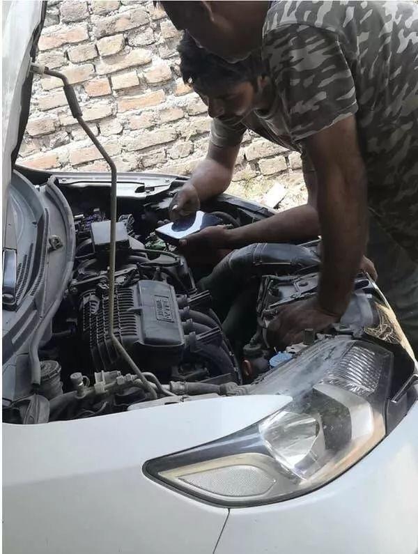 Pics that had us crying with laughter - #12 These Mechanics Are Literally Watching a YouTube Video to Figure It Out: Pics that had us crying with laughter - #12 These Mechanics Are Literally Watching a YouTube Video to Figure It Out: