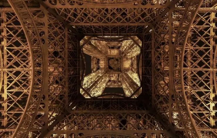 Extraordinary images showing the world from a new perspective - #26 Beneath The Eiffel Tower – A Steel Forest Of Rivets And Shadows