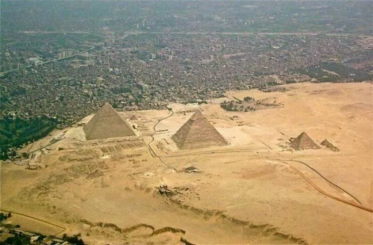 Extraordinary images showing the world from a new perspective - #42 Urban Meets Ancient: The Pyramids Bordering Giza City