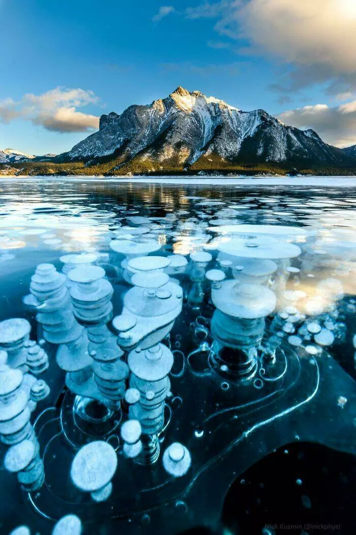 These 75 stunning photos are totally real no edits - #13 Frozen Methane Bubbles In Alberta’s Abraham Lake Phenomenon