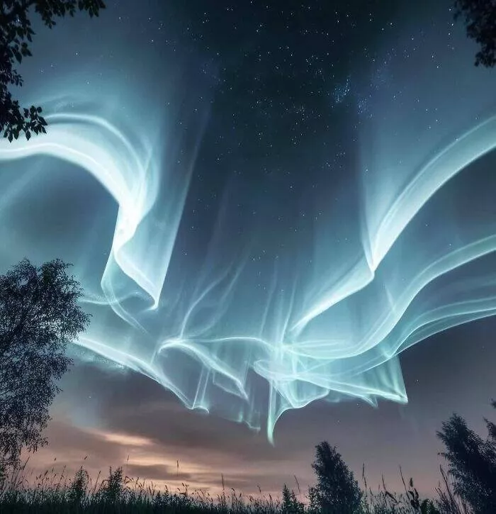 These 75 stunning photos are totally real no edits - #23 White Auroras Appear Over Finland In Rare Night Event