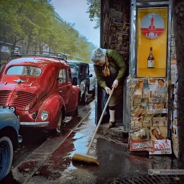 History brought back to life in vivid color - #32 After The Rain, Newspaper Vendor Tidies Her Paris Kiosk, 1955 Scene History brought back to life in vivid color - #32 After The Rain, Newspaper Vendor Tidies Her Paris Kiosk, 1955 Scene