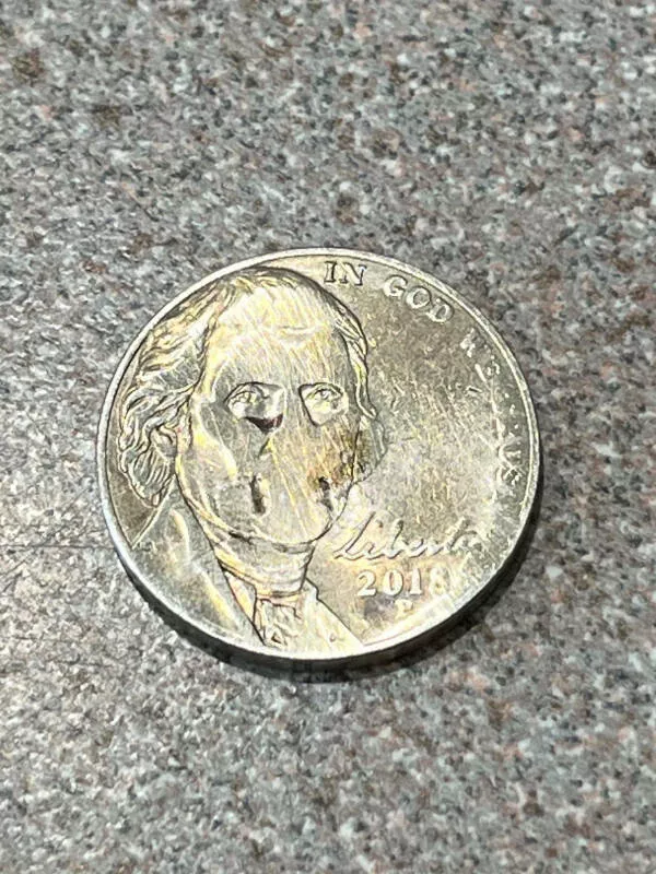 Striking photos youll instantly want to show others - #4 Nickel Pulled From Dryer Looks Haunted Striking photos youll instantly want to show others - #4 Nickel Pulled From Dryer Looks Haunted