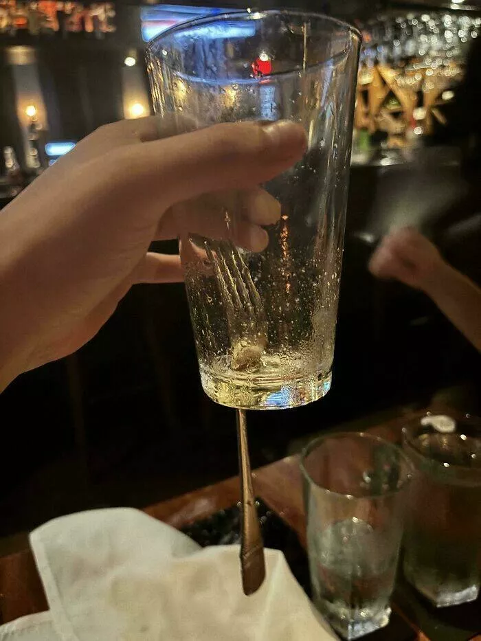 Intriguing photos with amazing stories - #32 Fork Falls into Glass, Forms a Perfect Hole Without Breaking It