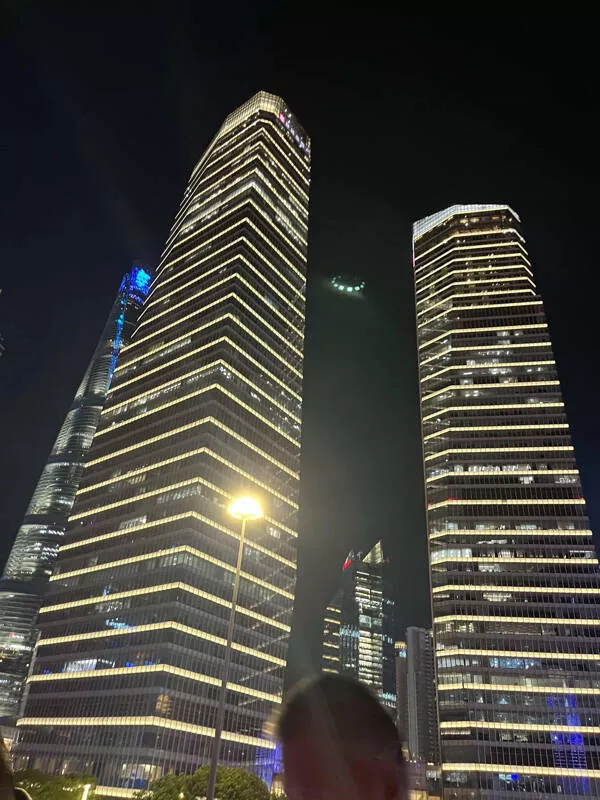 Incredible moments frozen in time - #14 Strange Green-Lit Object Captured in Photo Above Shanghai