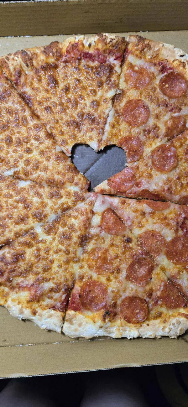 Captivating moments frozen in time - #4 My husband and I each took a bite of our pizza before leaving—and bam, accidental heart shape! Captivating moments frozen in time - #4 My husband and I each took a bite of our pizza before leaving—and bam, accidental heart shape!