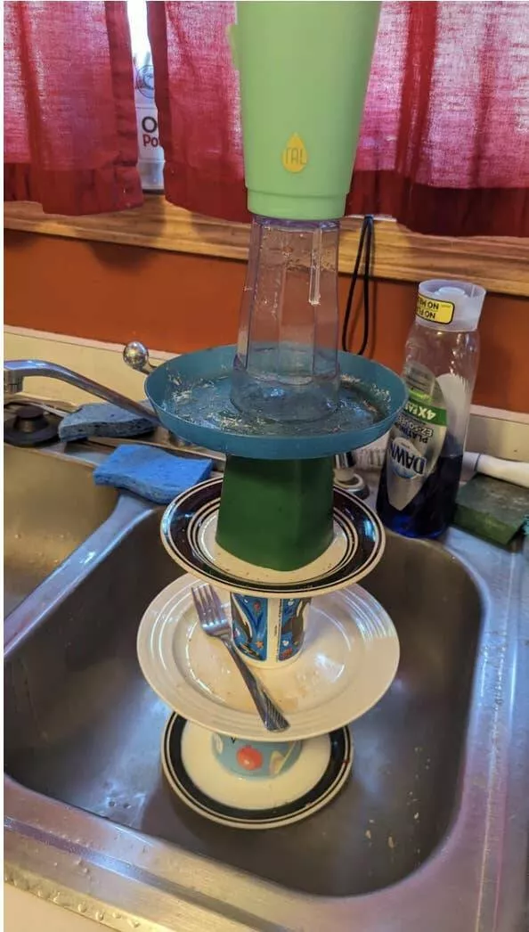 When madness meets masterful vision - #29 Kid “cleans” sink by piling dishes into a Jenga-style tower
