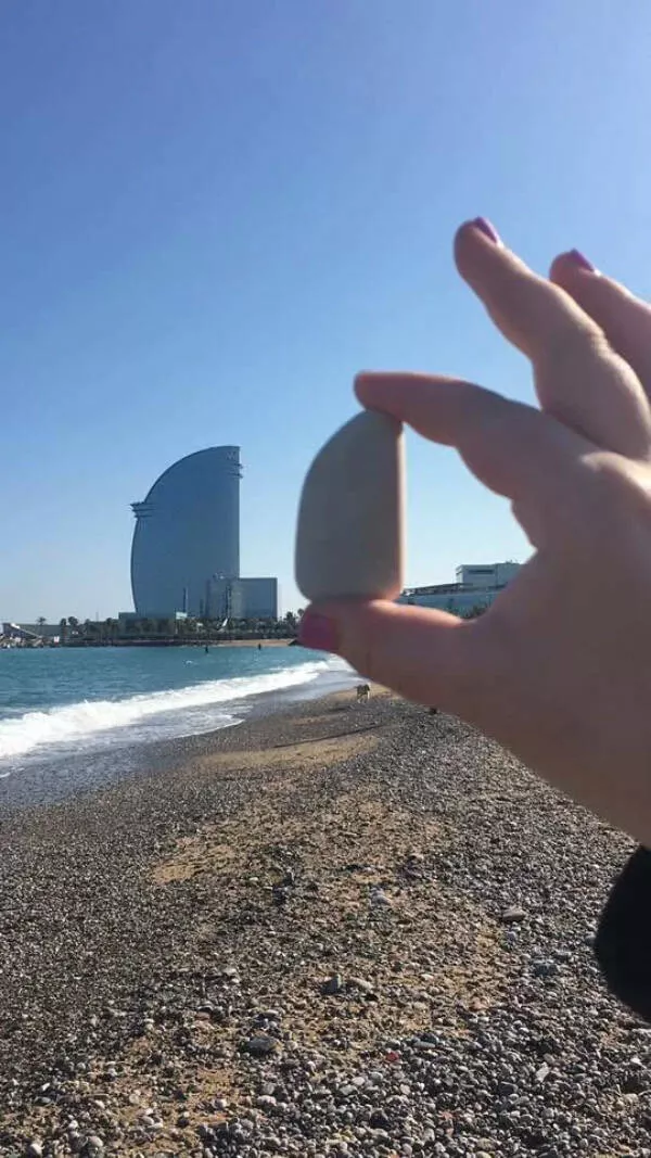 Awesome photos that stop you mid scroll - #24 Beach rock carved by waves to mirror a skyscraper perfectly